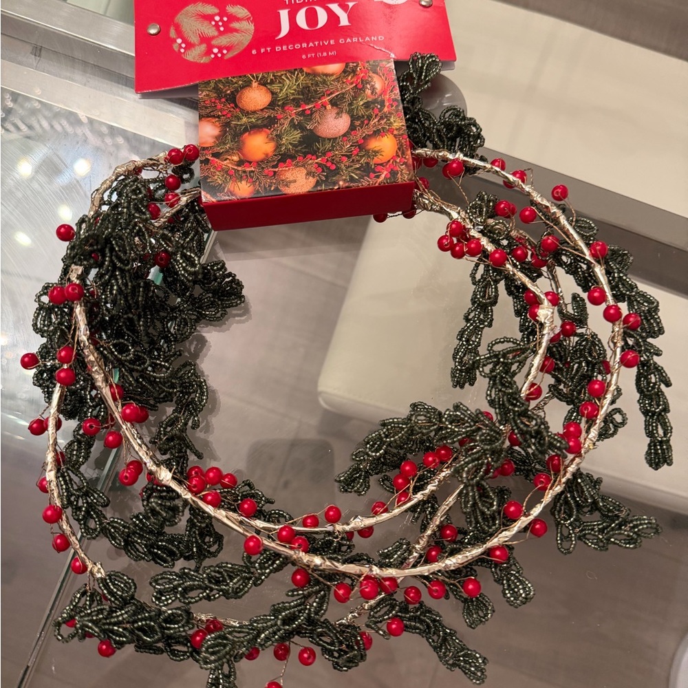 Festive Garland with Red Berries and Green Leaves